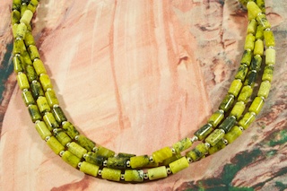 Beautiful 3 Strand Necklace featuring Genuine Mohave Turquoise with Sterling Silver Beads. Sterling Silver Cones and Clasp. Created by Santo Domingo Artist Carol Pacheco.The Santo Domingo Pueblo is in New Mexico, near Santa Fe.
